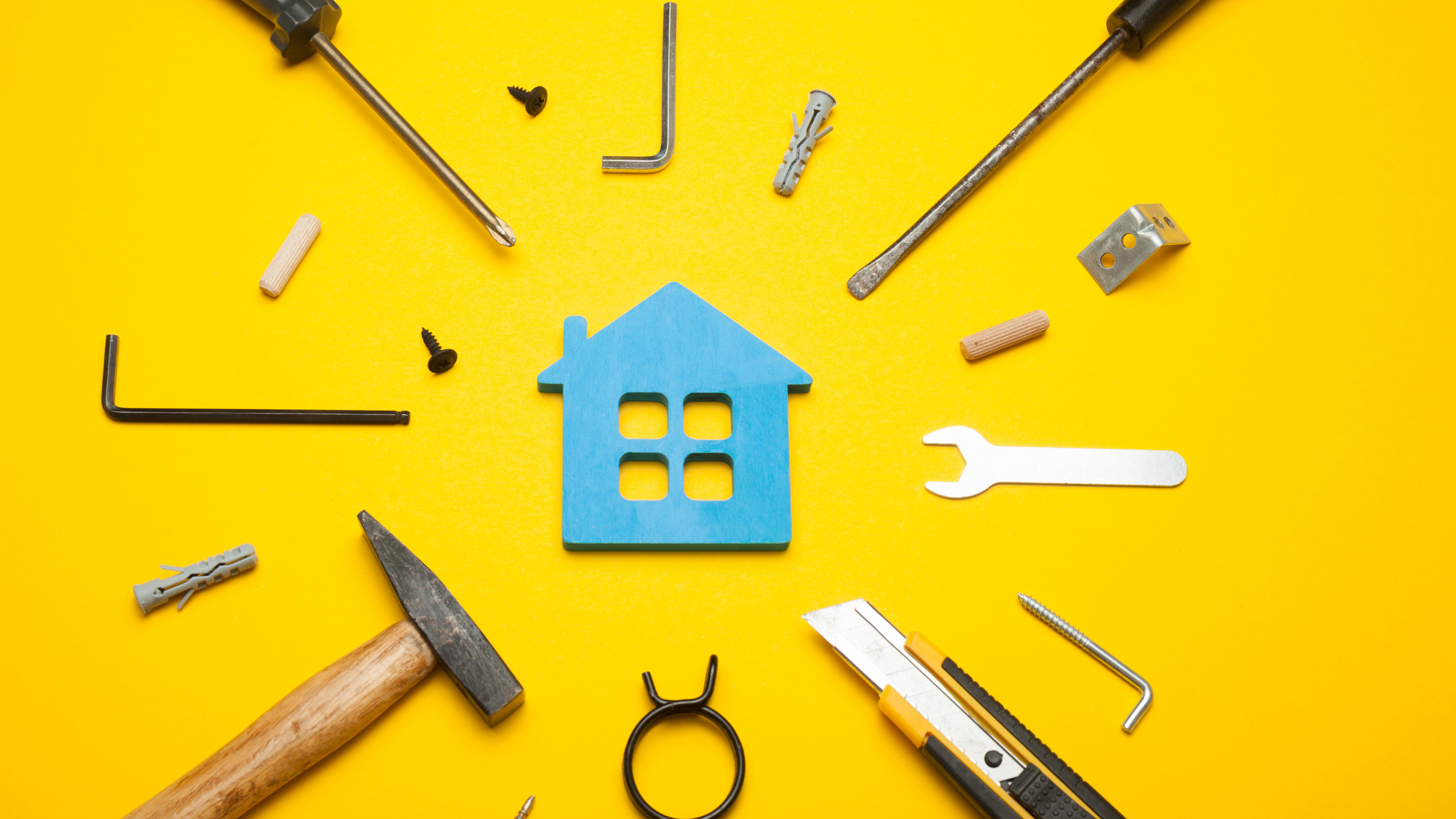 Home service tools around a blue house icon representing Local SEO for service businesses